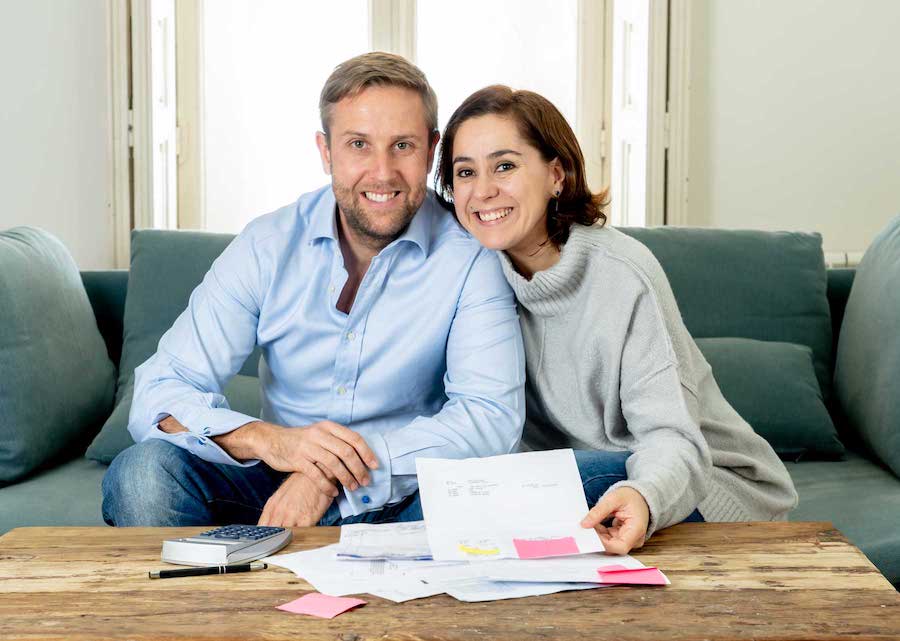 Happy Young Couple Feeling Proud Of Home Finance